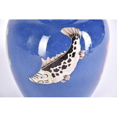 214 - A Chinese powder blue ginger jar & cover, in the Kangxi style, painted with four fish to the body an... 