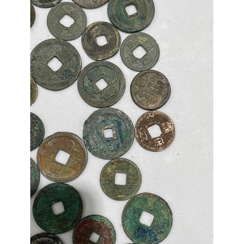 220 - A collection of fifty Chinese Tang - Song dynasty coins, 22mm - 41mm