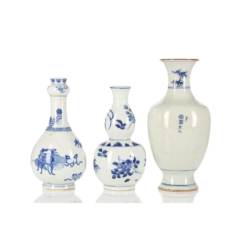 225 - Three Chinese blue & white vases, one with garlic mouth and decorated with antiques, 20.5cm; a doubl... 