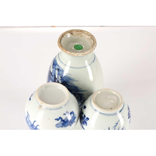 225 - Three Chinese blue & white vases, one with garlic mouth and decorated with antiques, 20.5cm; a doubl... 