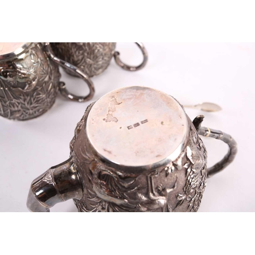 228 - A Chinese three piece silver teaset by Wang Hing, late Qing, each piece of barrel form, the teapot r... 