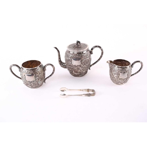 228 - A Chinese three piece silver teaset by Wang Hing, late Qing, each piece of barrel form, the teapot r... 