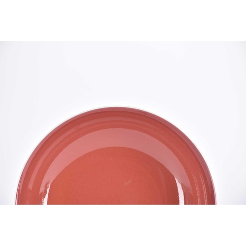 233 - A Chinese aubergine glazed saucer dish, the glaze a uniform colour beneath a white rim, apocryphal b... 