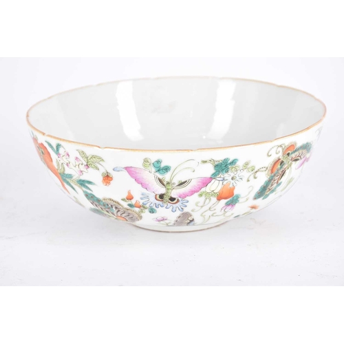 237 - A Chinese famille rose butterfly bowl, the interior with a single butterfly in a border of flowers, ... 