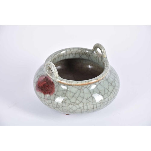 244 - A Chinese Ge ware censer, of compressed form with loop handles, the shoulder with a red splash, on t... 