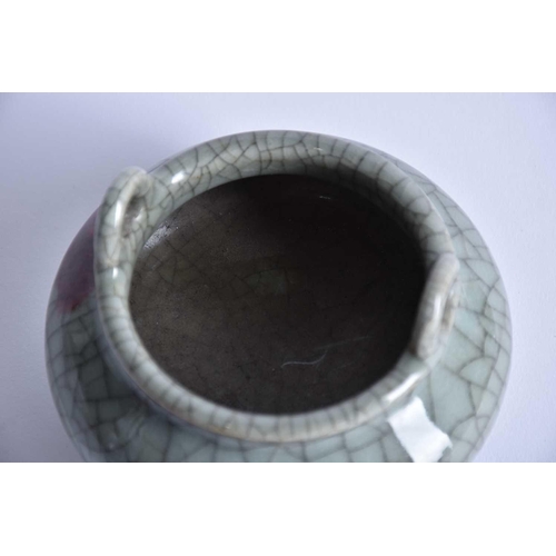 244 - A Chinese Ge ware censer, of compressed form with loop handles, the shoulder with a red splash, on t... 