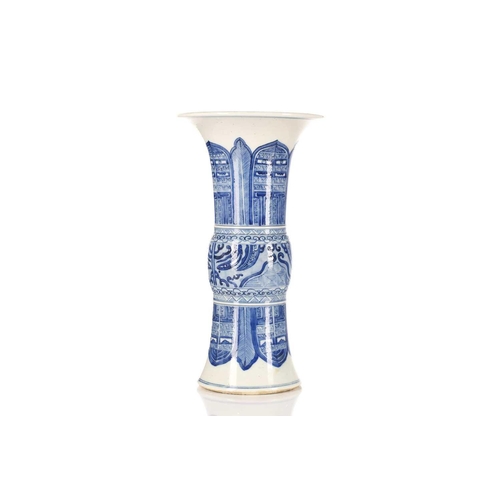 245 - A Chinese blue and white Gu form vase, the centre painted with Taotie masks between leaves and blade... 