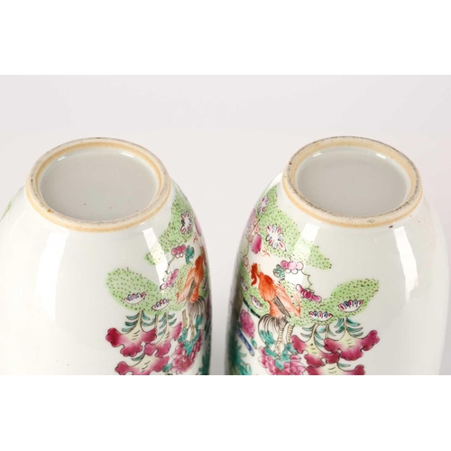 260 - A pair of Chinese porcelain vases and covers, of cylindrical form tapering at the base, the covers w... 