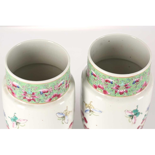 260 - A pair of Chinese porcelain vases and covers, of cylindrical form tapering at the base, the covers w... 