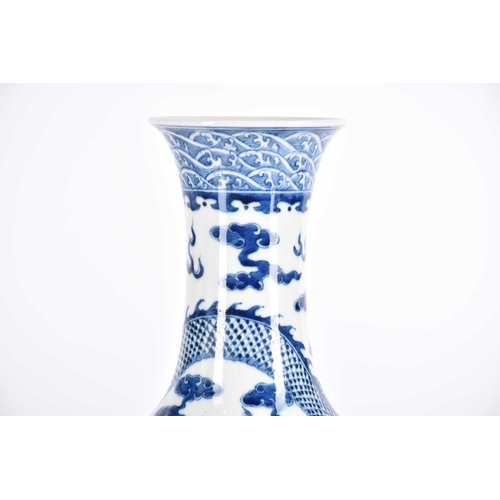 261 - A large Chinese blue & white tianqiuping dragon vase, the flared neck painted with spuming waves abo... 