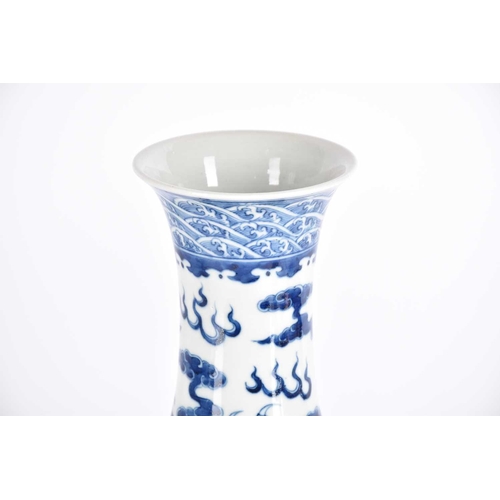 261 - A large Chinese blue & white tianqiuping dragon vase, the flared neck painted with spuming waves abo... 