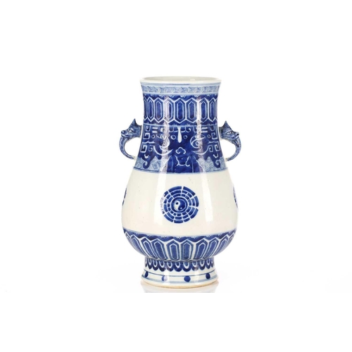 262 - A Chinese porcelain blue & white Hu form vase, with bixie mask and tongue handles, painted with Taot... 