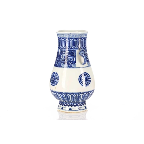 262 - A Chinese porcelain blue & white Hu form vase, with bixie mask and tongue handles, painted with Taot... 