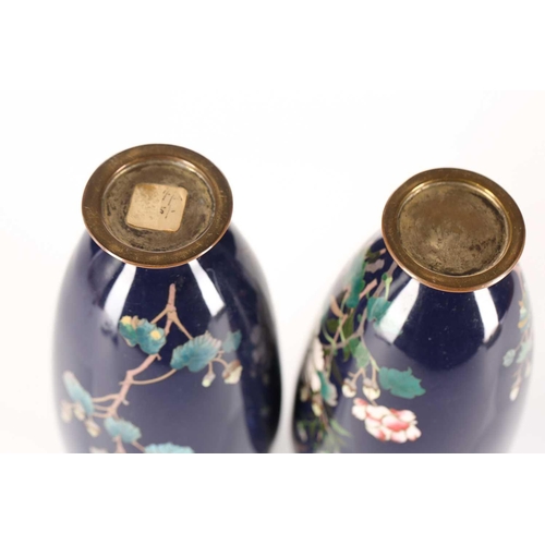 263 - A pair of Japanese Meiji period cloisonné vases, with floral decoration in polychrome enamels, on a ... 