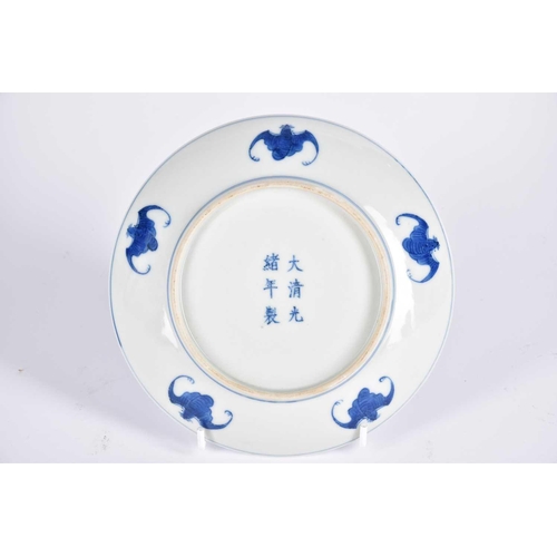 267 - A Chinese blue & white saucer dish, painted with two opposing dragons facing a flaming pearl amongst... 