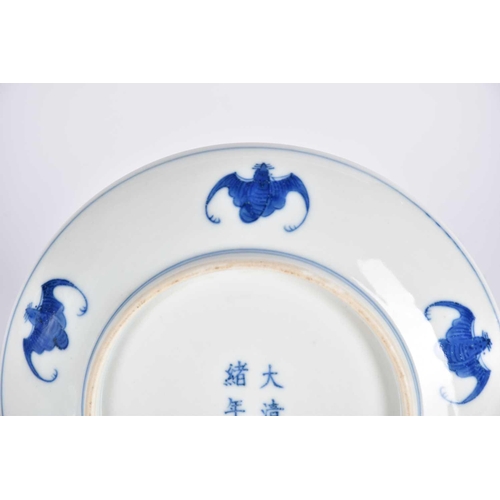 267 - A Chinese blue & white saucer dish, painted with two opposing dragons facing a flaming pearl amongst... 