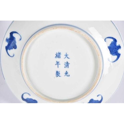 267 - A Chinese blue & white saucer dish, painted with two opposing dragons facing a flaming pearl amongst... 