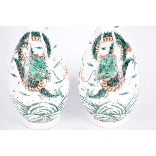 270 - A pair of Chinese famille verte vases, painted with a dragon chasing a filming pearl amongst clouds,... 