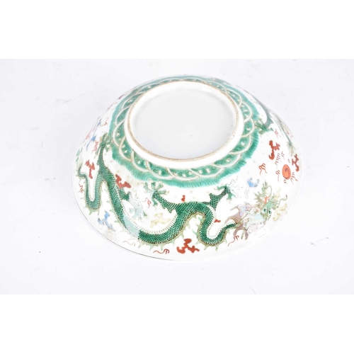 272 - A Chinese famille verte dragon bowl, the interior painted with waves and a rock, the exterior with t... 