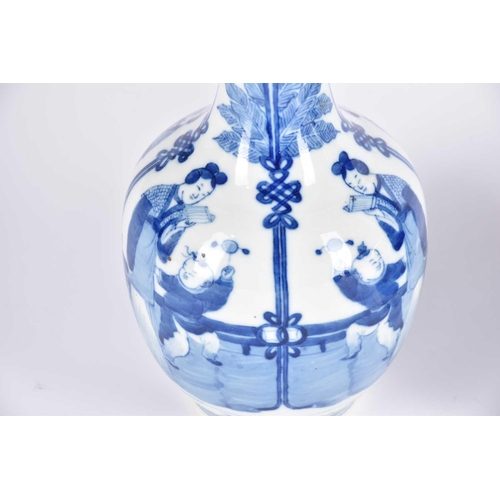 276 - A near pair of Chinese blue & white bottle vases, the neck painted with peaches and flowers above ba... 