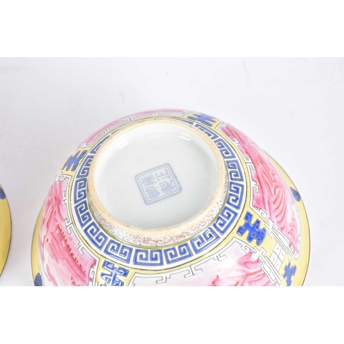 277 - A pair of Chinese famille rose bowls, the interiors painted with a sprig of peony, the exterior with... 