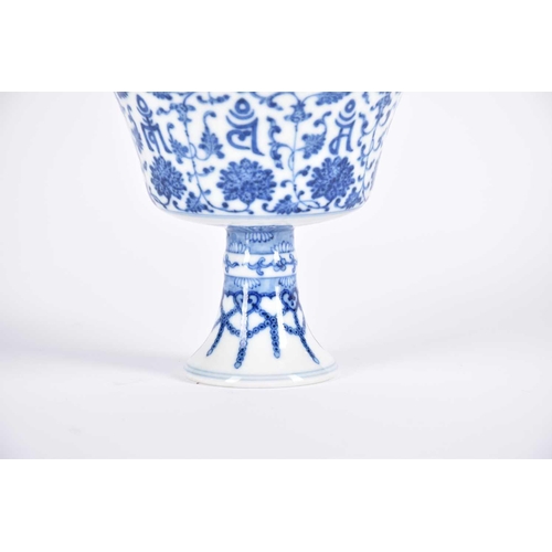 291 - A Chinese blue & white 'Lanca Character' stem cup, the steep flaring sides with lanca characters wit... 