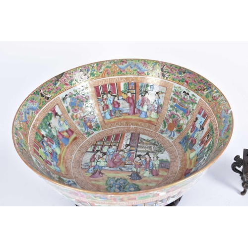 296 - A large Chinese canton enamel bowl, mid 20th century, painted throughout with panels of figures with... 