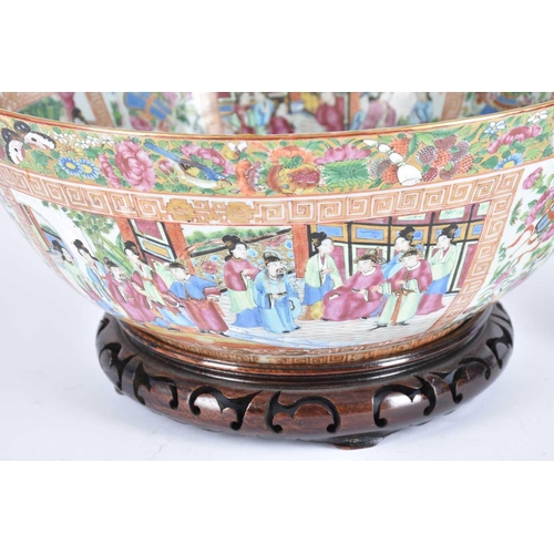 296 - A large Chinese canton enamel bowl, mid 20th century, painted throughout with panels of figures with... 