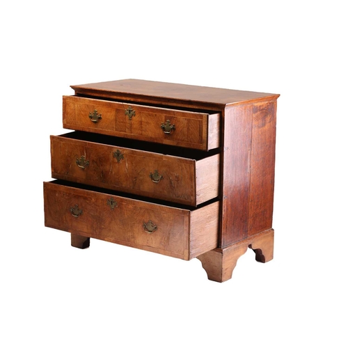 304 - A Queen Anne walnut and oak chest of four long drawers With broad crossbanded top above drawer front... 