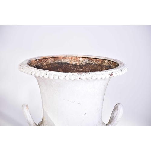 310 - A pair of cast iron two-handled campana urns with gadrooned rims. on composite square socle bases. 5... 