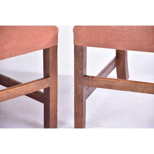 315 - A pair of George III mahogany library chairs with stuff over square backs and seats, on squared supp... 