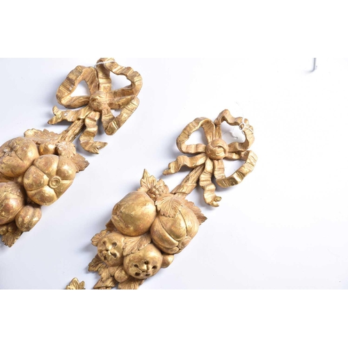 318 - A pair of 19th century carved wood and gilt gesso wall appliques in the form of hanging harvest boun... 