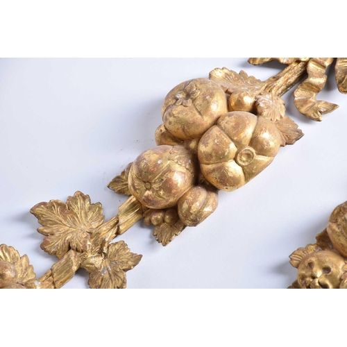 318 - A pair of 19th century carved wood and gilt gesso wall appliques in the form of hanging harvest boun... 