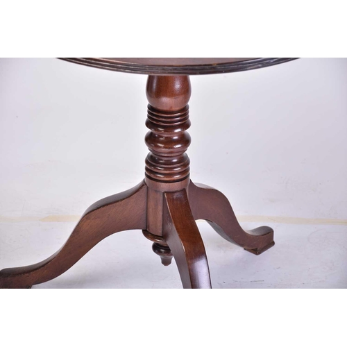 319 - A George III mahogany revolving circular tripod table together with one mahogany and another square-... 