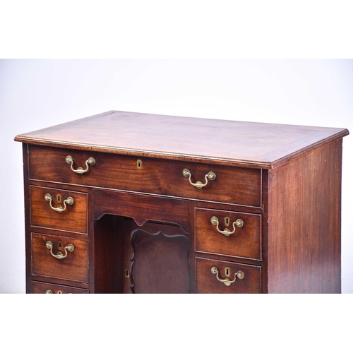 322 - A George III mahogany kneehole writing desk the frieze drawer with fitted interior and baize lined s... 