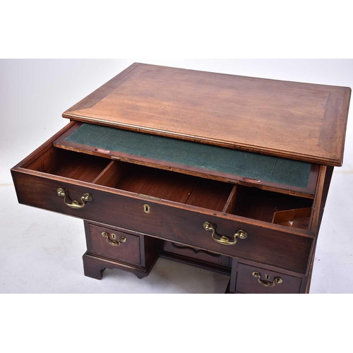 322 - A George III mahogany kneehole writing desk the frieze drawer with fitted interior and baize lined s... 