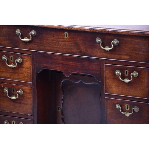 322 - A George III mahogany kneehole writing desk the frieze drawer with fitted interior and baize lined s... 