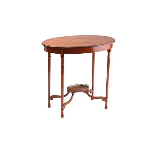 325 - A Sheraton style figured satinwood oval centre table, early 20th century, the crossbanded top inlaid... 