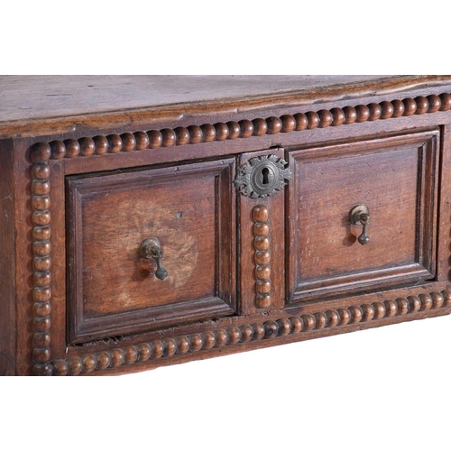 327 - A late 17th-century oak two drawer side table each drawer with geometric moulding and split bobbin d... 