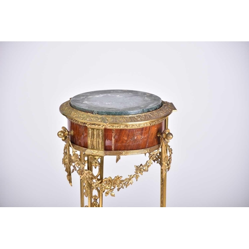 331 - A Louis XVI style marble-topped gilt bronze and mahogany circular gueridon, late 19th century, with ... 