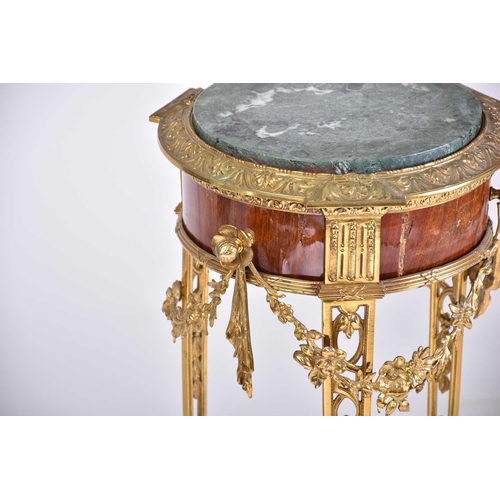 331 - A Louis XVI style marble-topped gilt bronze and mahogany circular gueridon, late 19th century, with ... 