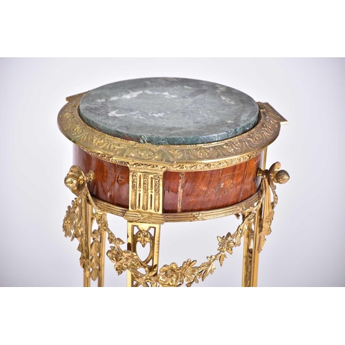 331 - A Louis XVI style marble-topped gilt bronze and mahogany circular gueridon, late 19th century, with ... 