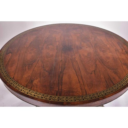 333 - An early 19th century figured rosewood breakfast table, the top with a running band of stylized anth... 