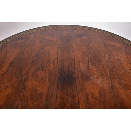 333 - An early 19th century figured rosewood breakfast table, the top with a running band of stylized anth... 