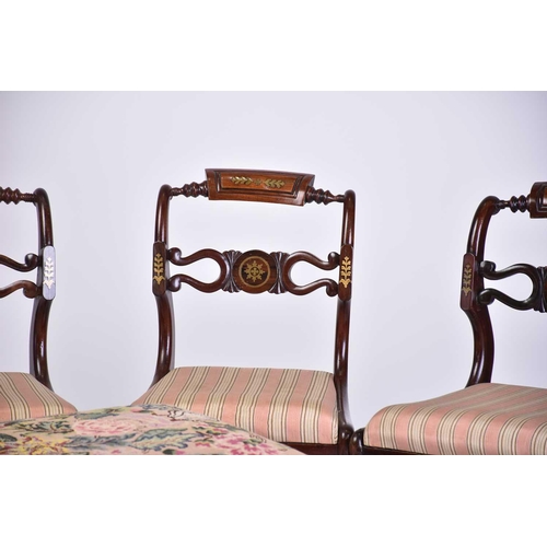 335 - A set of four Regency brass inlaid mahogany side chairs with turned backrest and pierced and shaped ... 