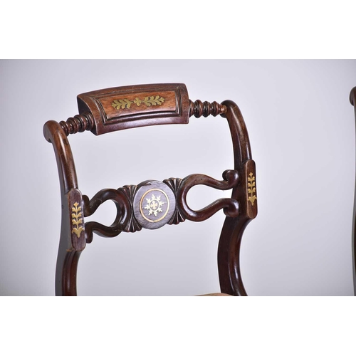 335 - A set of four Regency brass inlaid mahogany side chairs with turned backrest and pierced and shaped ... 