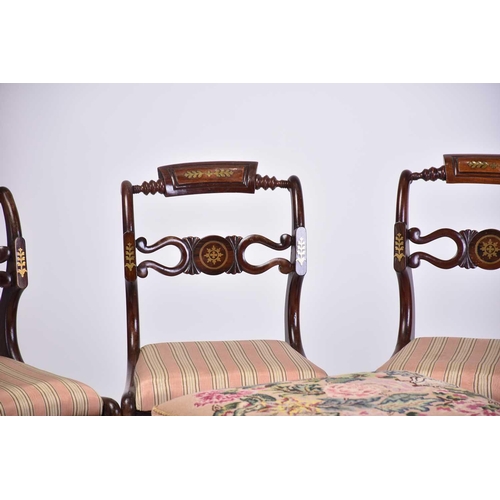 335 - A set of four Regency brass inlaid mahogany side chairs with turned backrest and pierced and shaped ... 