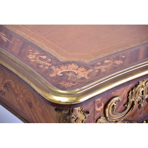 342 - A French Louis XV style rococo marquetry and Kingwood bureau plat of inverted breakfront form, late ... 