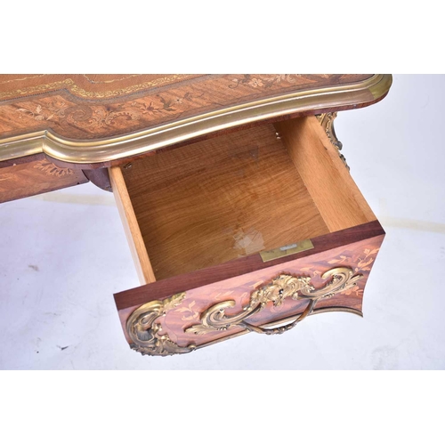 342 - A French Louis XV style rococo marquetry and Kingwood bureau plat of inverted breakfront form, late ... 