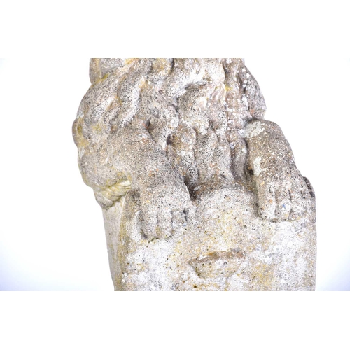 343 - A pair of cast stone figures of standing heraldic lions each holding a shield with 